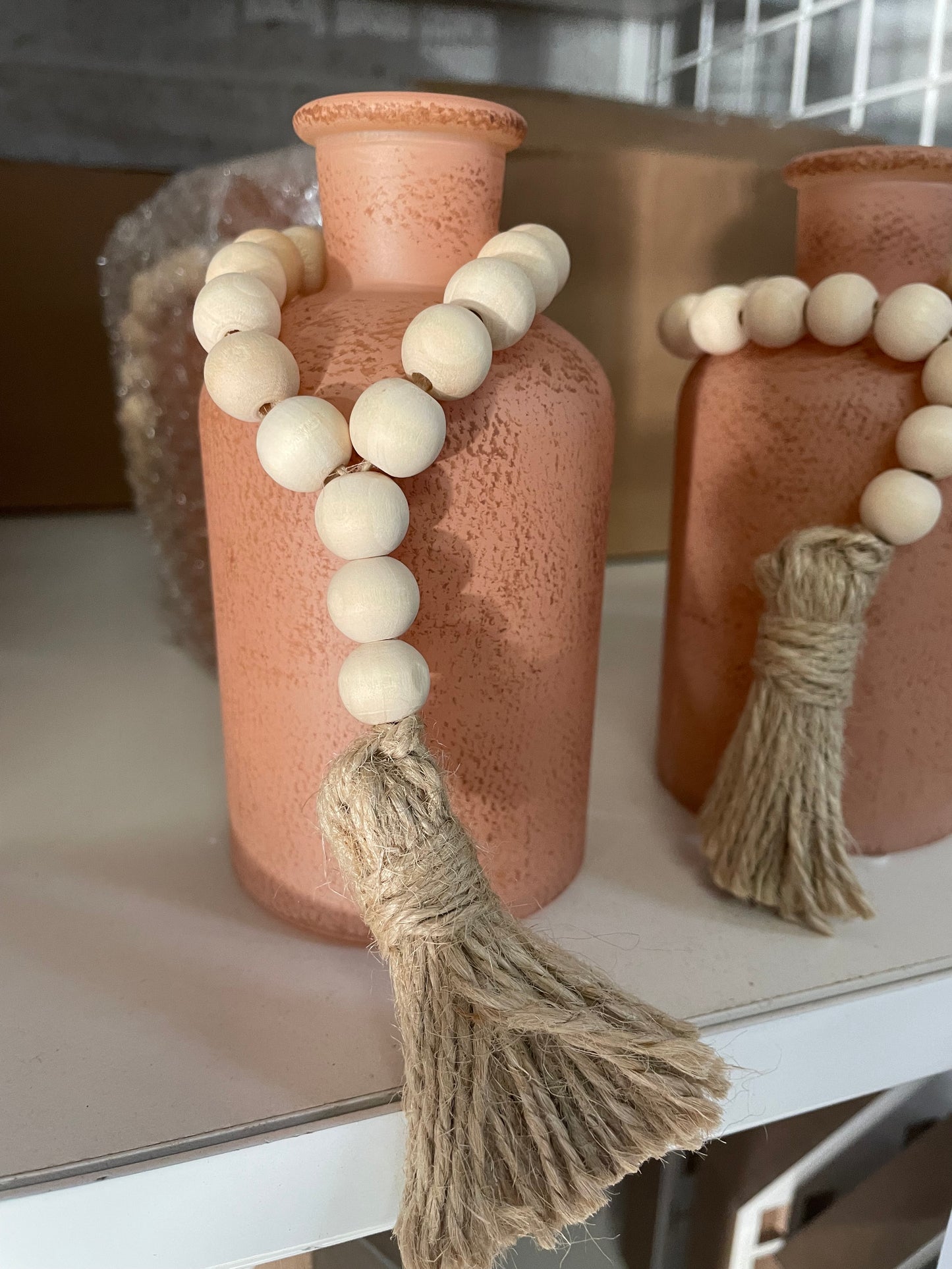 Clay colored vases with bead detail